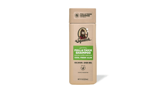 Shampoo bottle with a green label on a green background