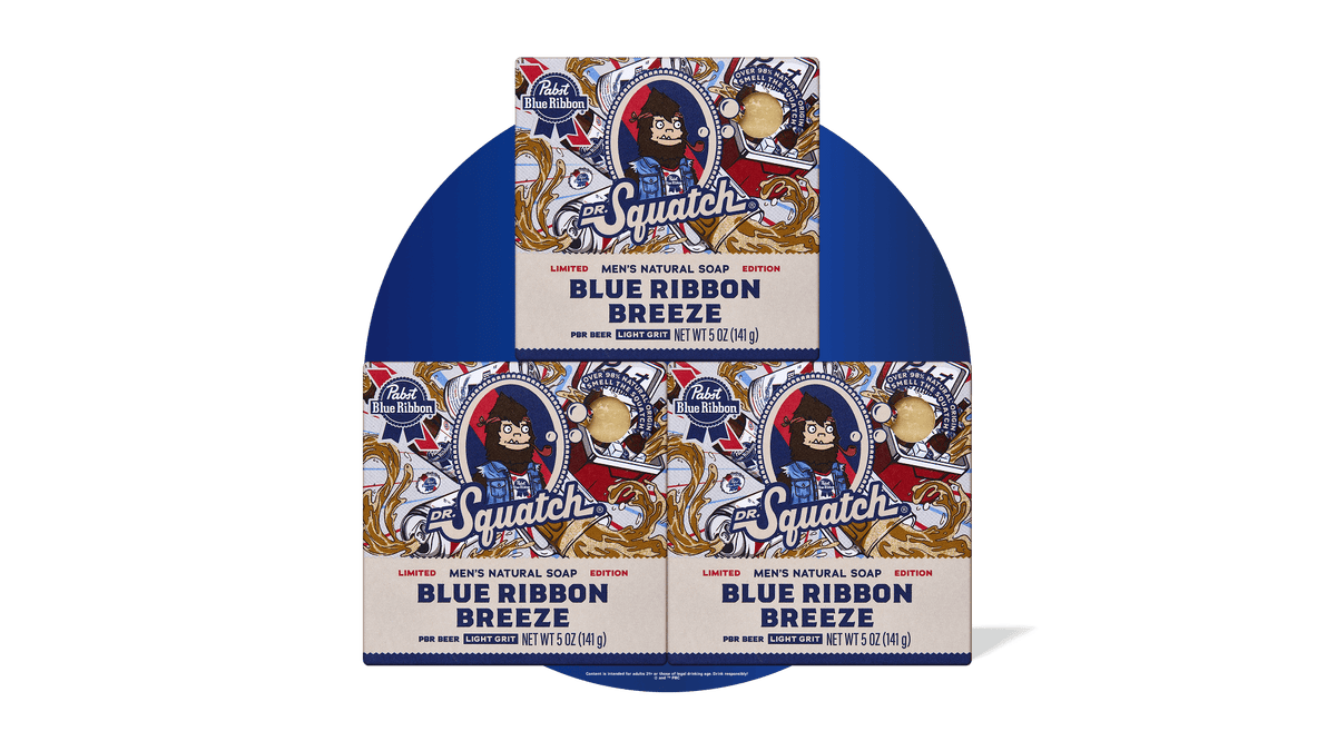 Three bars of Dr. Squatch Blue Ribbon Breeze men's natural soap in blue packaging with vintage Pabst Blue Ribbon branding.